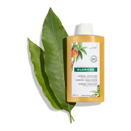 Klorane Mango İçerikli Şampuan 400 ml sarı şişe ve mango yaprağı
